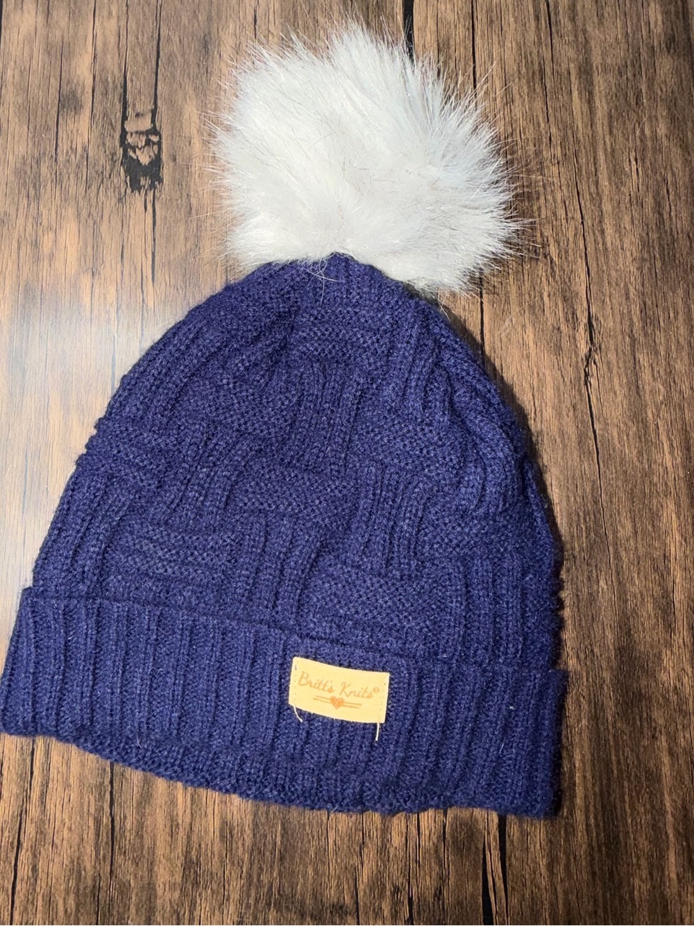 Britt’s Knit Navy Pom Pom Beanie with fuzzy interior liner